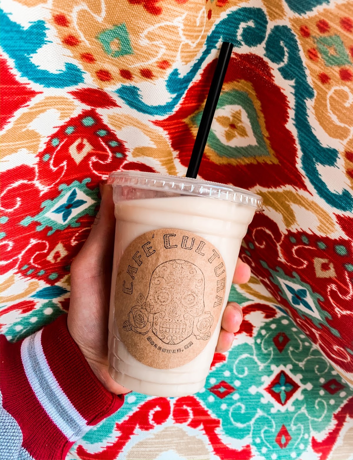 A blended horchata drink on a southwestern patterned blanket